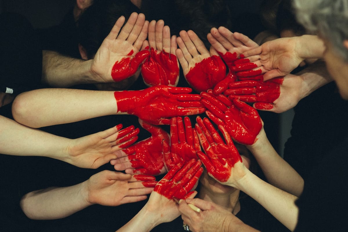 Volunteers with hands together
